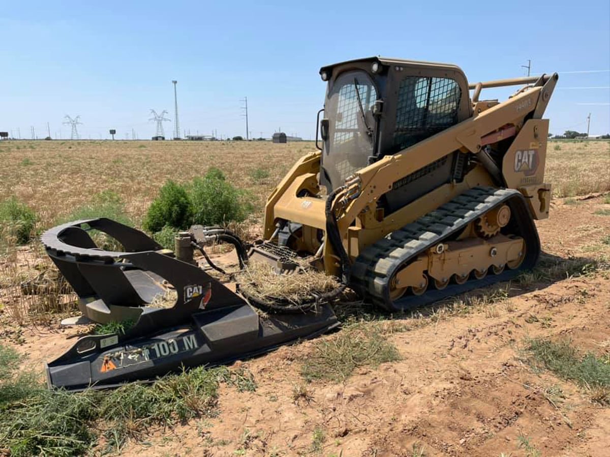 Land clearing machine preparing site for construction.